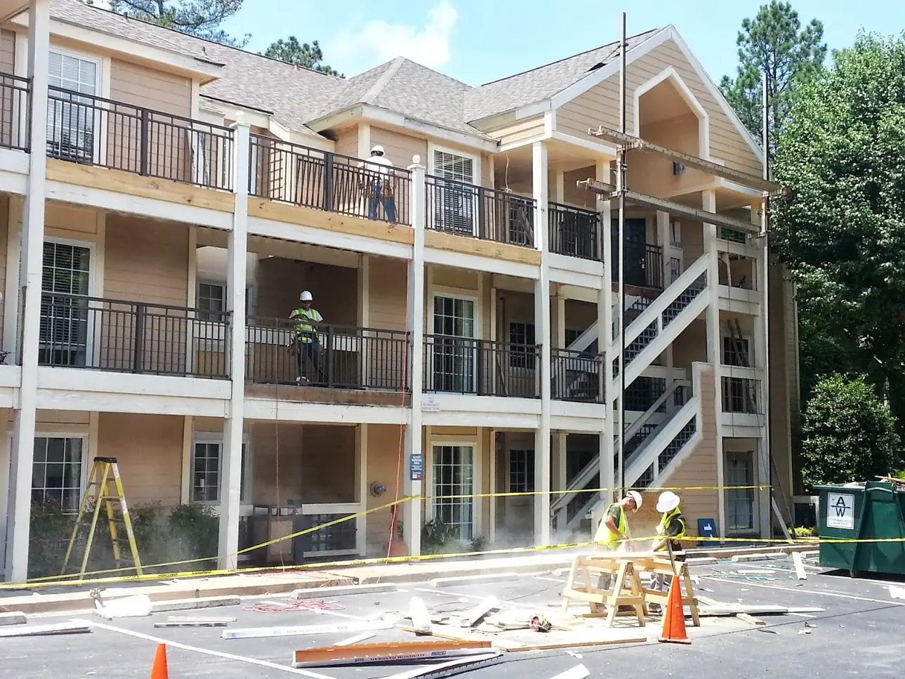 Crew completing exterior restoration on a multi-unit apartment building